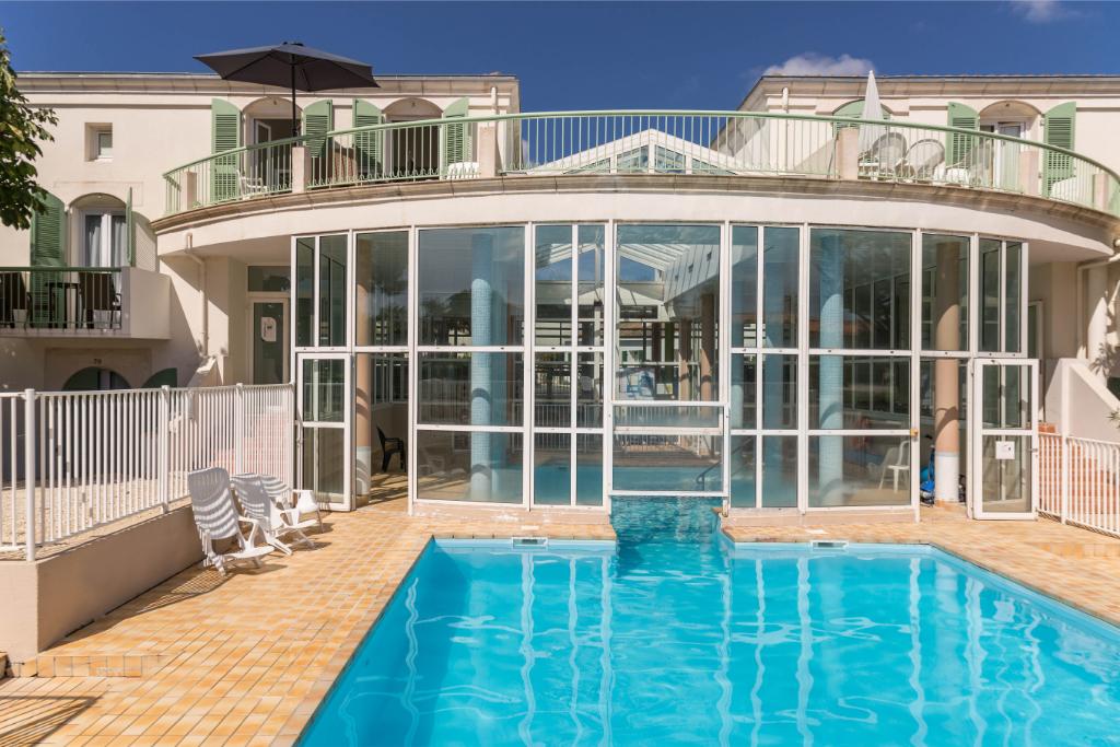 Swimming pool area near Le Palais des Gouverneurs 2p 4p Superior in France