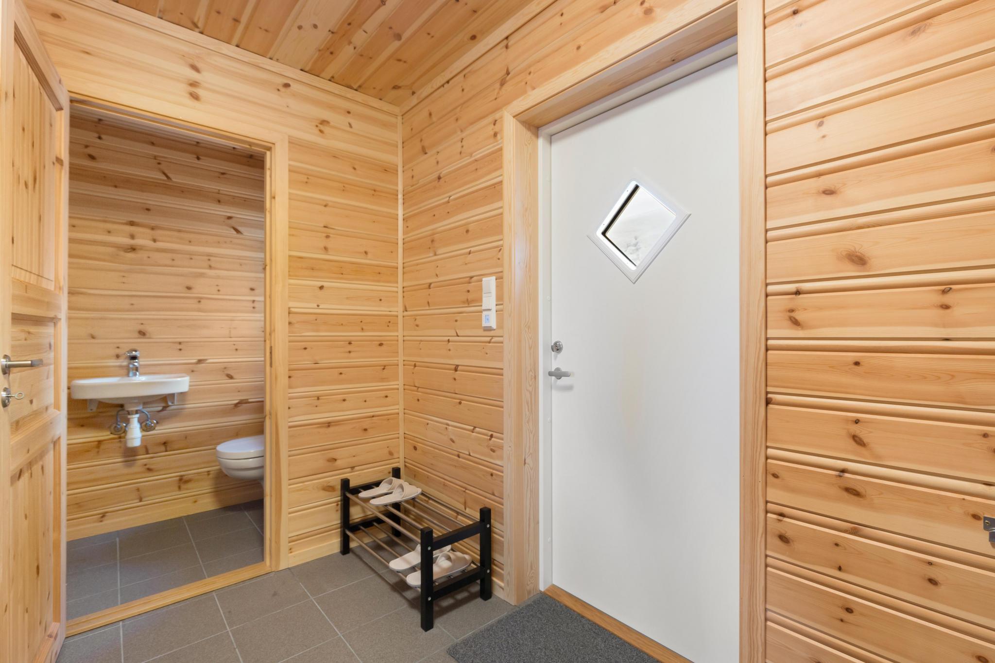 Outdoor terrace and garden at Solstråle Hytte 6p in NO