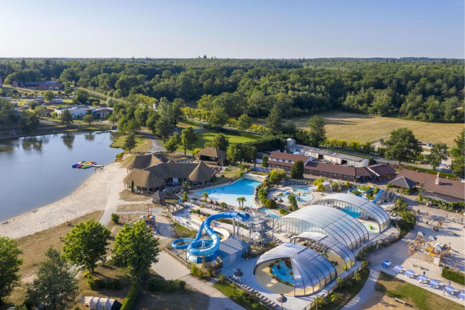 Swimming pool area near Tree-house Forest Camp 2p in France
