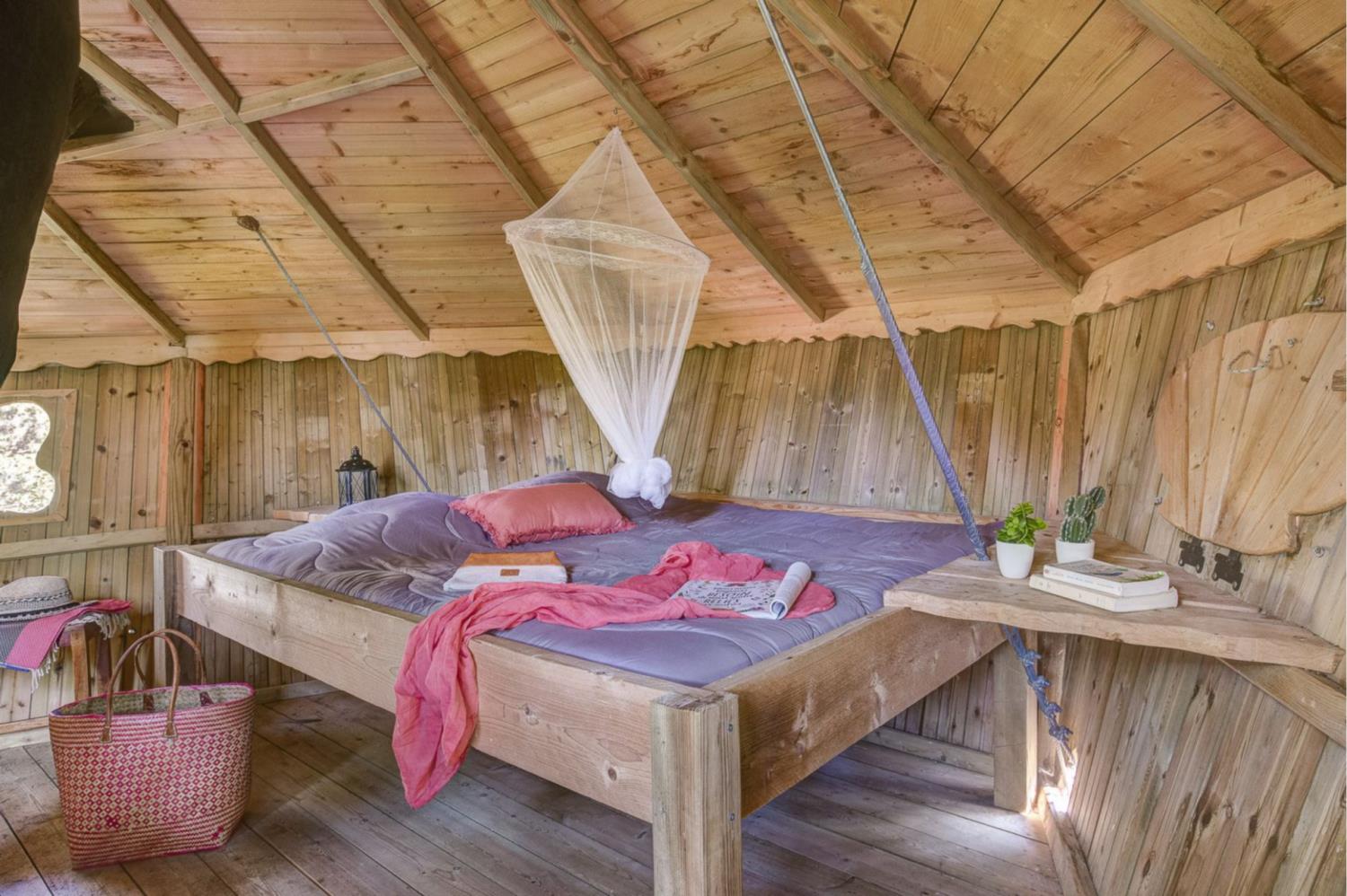 Bedroom accommodation at Tree-house Forest Camp 2p in France
