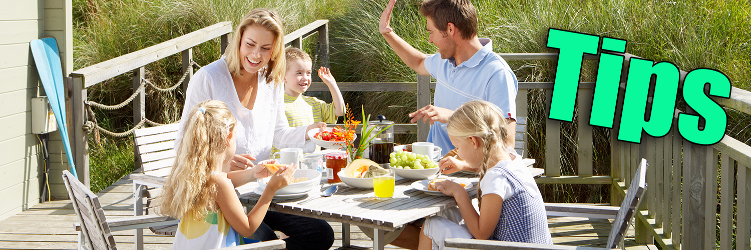 happy family breakfast on bungalow terrace